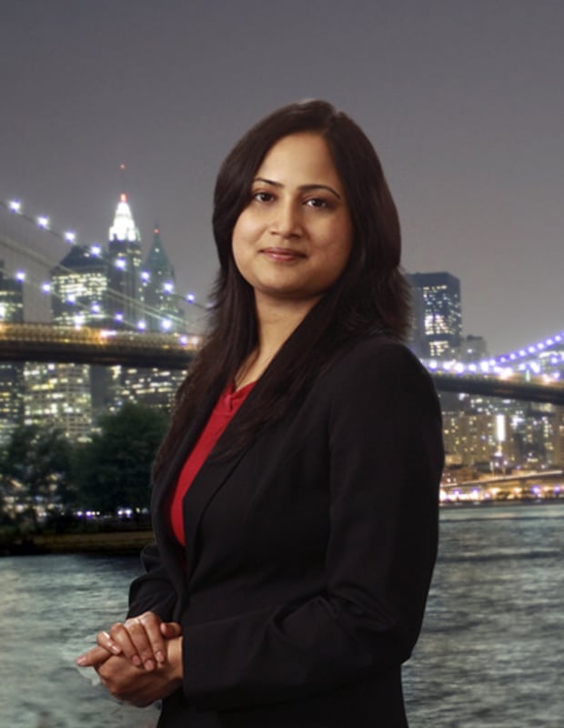 Executive portrait with a city skyline at night