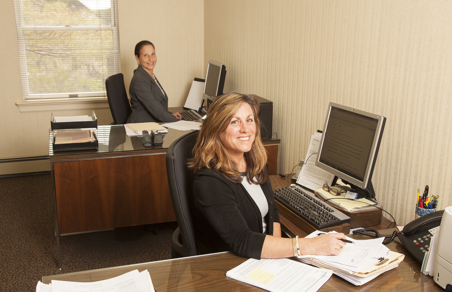 Office manager at work at her desk