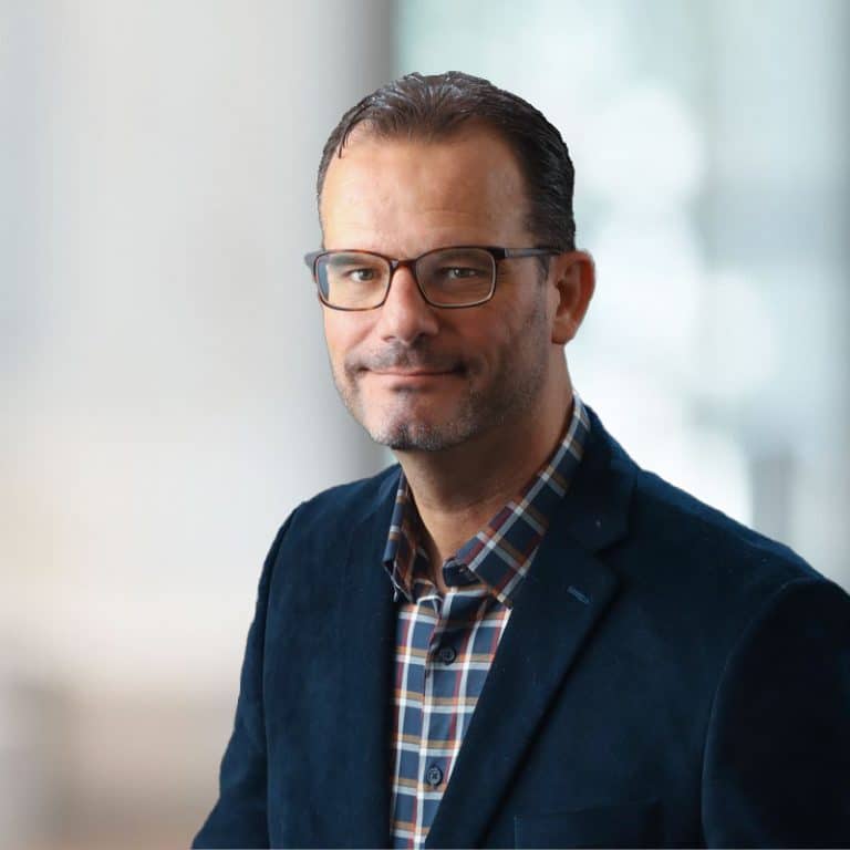 Business portrait in a modern office with soft background