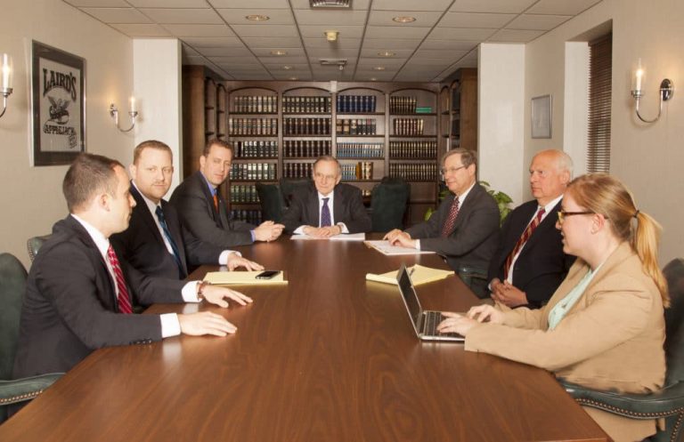 Law firm partners in a meeting around a conference table